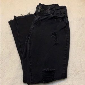 Black ripped skinny jeans.